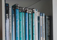 Books with blue covers on shelf