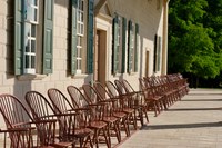 Back of mansion with chairs