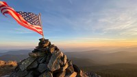 American flag on top of mountain